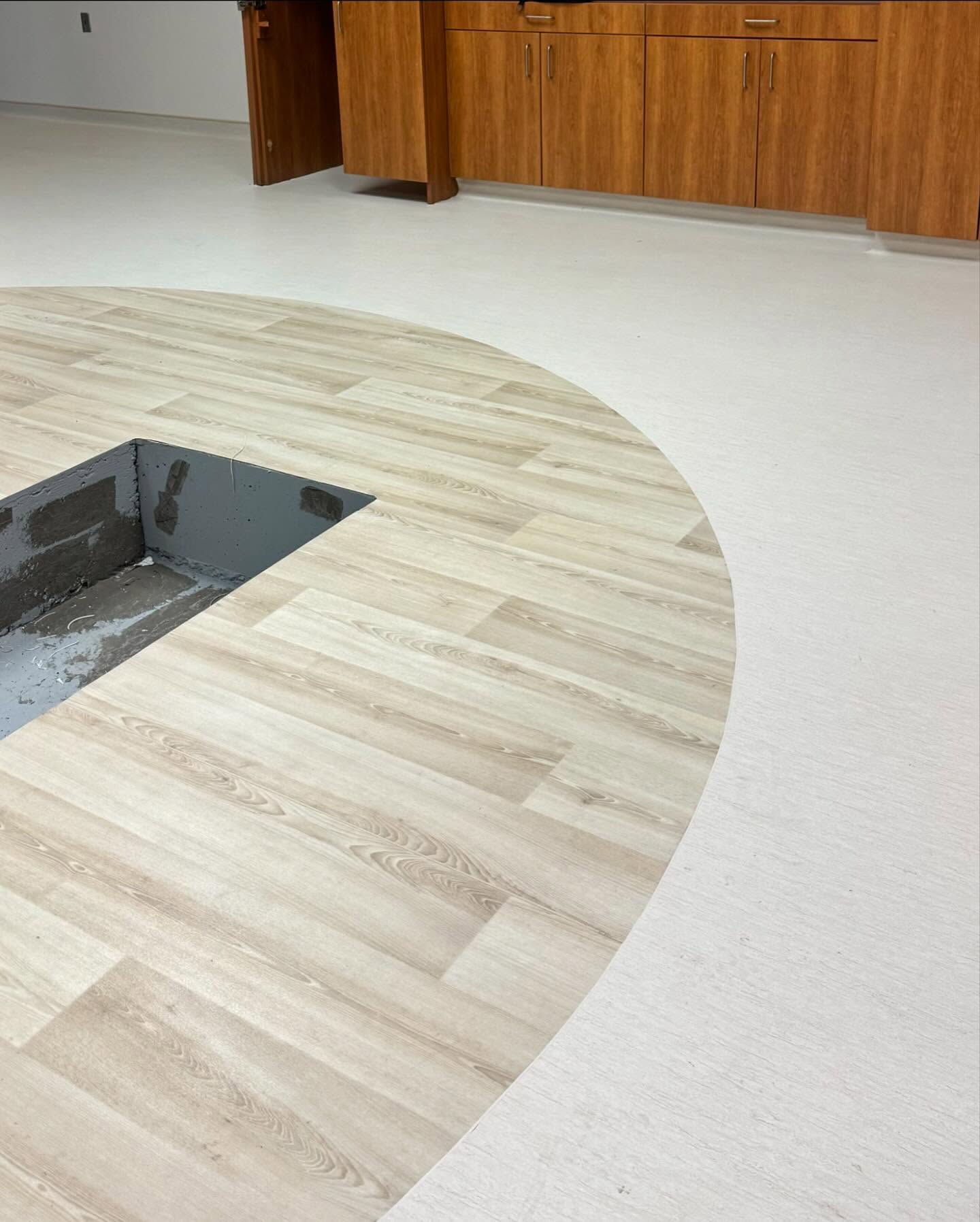Custom flash cove flooring installation — seamless floor-to-wall transition
